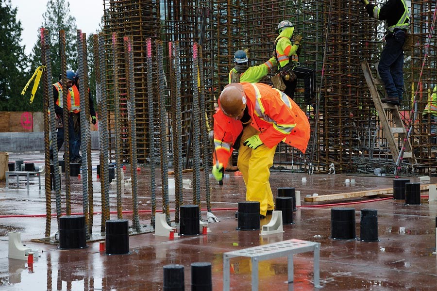 man working on construction site in the rain