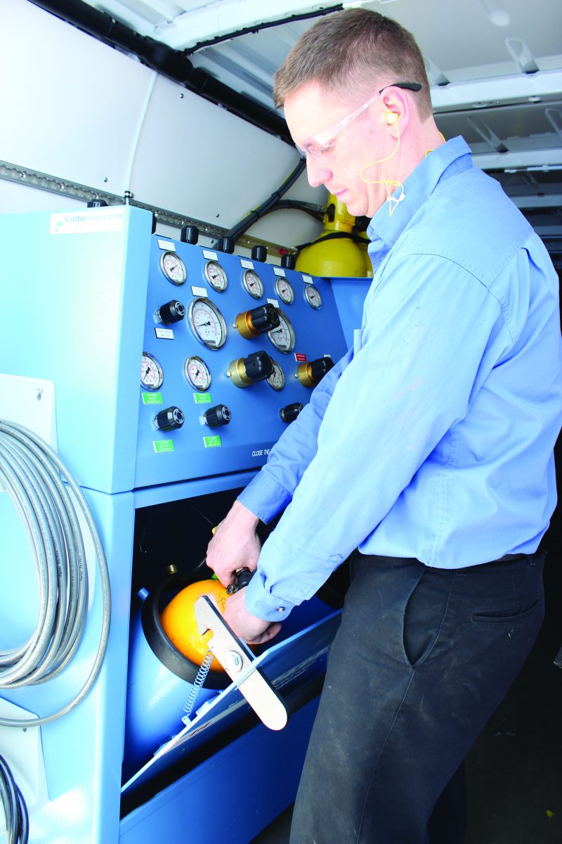 man inspecting a fire service kit