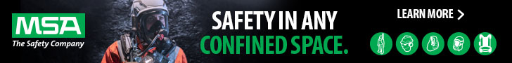 person wearing respiratory and fall protection in a confined space