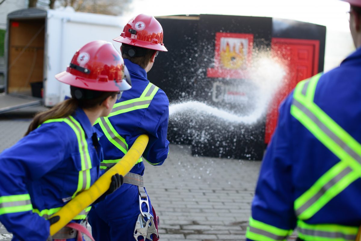 team in mining competition testing their fire fighting skills