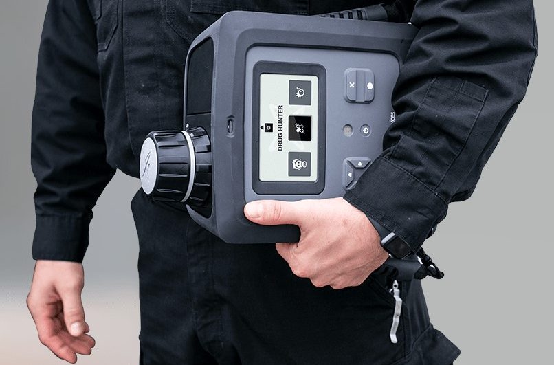 EMS worker holding an MX908 Portable Mass Spectrometer