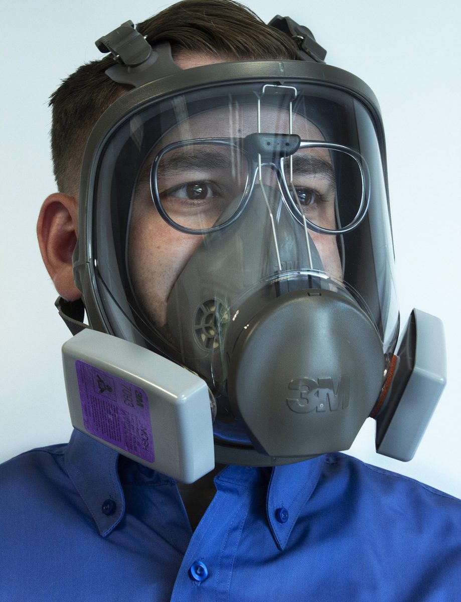 person wearing fi;; face mask with prescription safety inserts