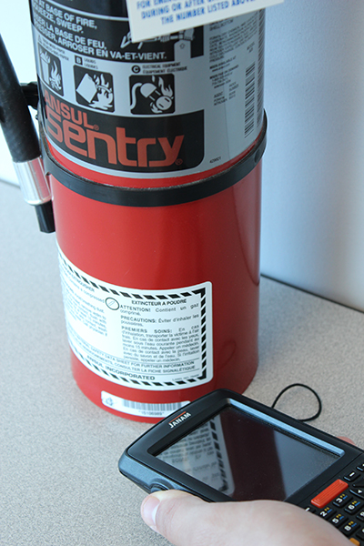 Fire extinguisher sitting on a table being serviced